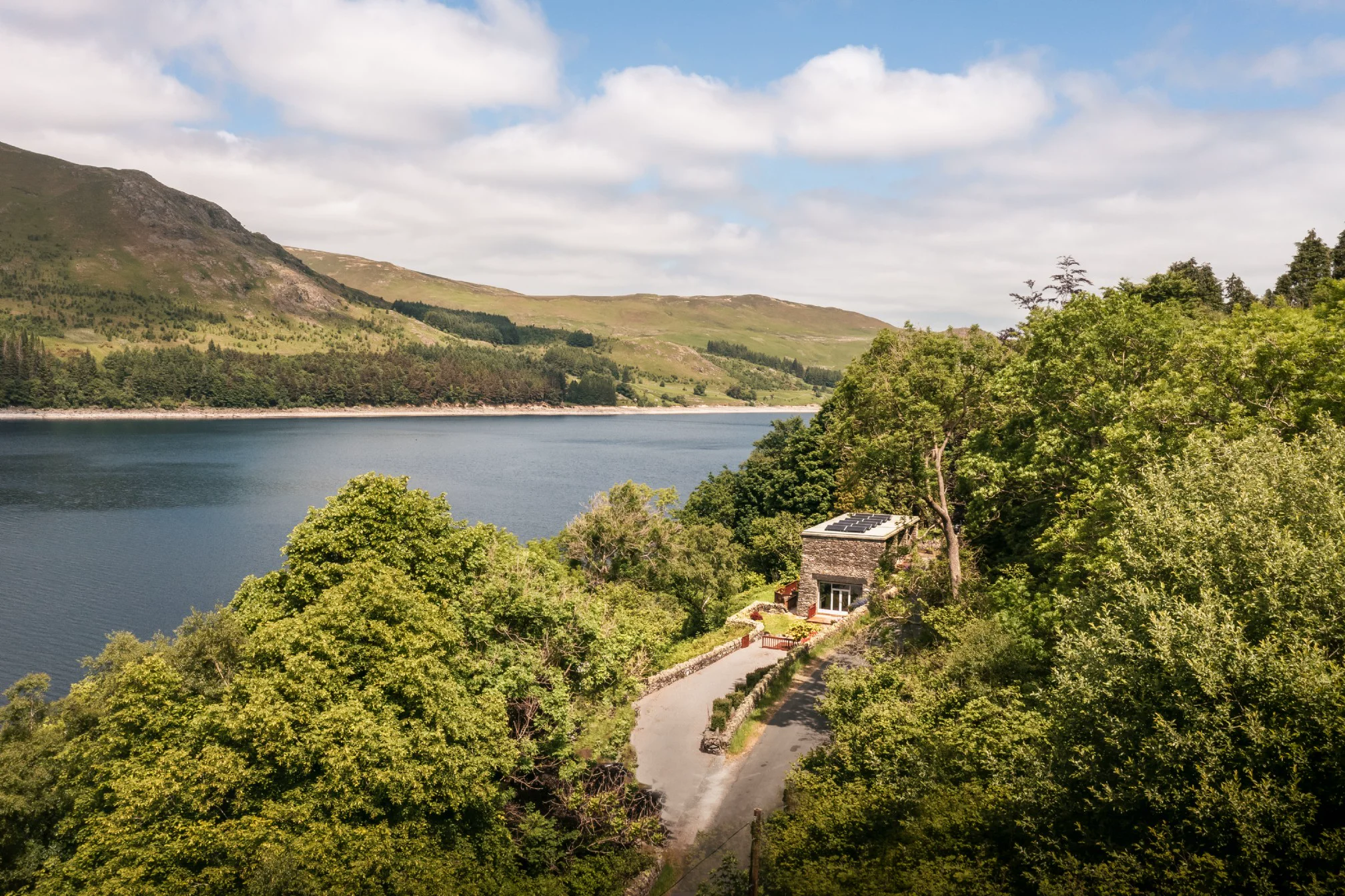 Aerial view of Aquila on Haweswater with mountains