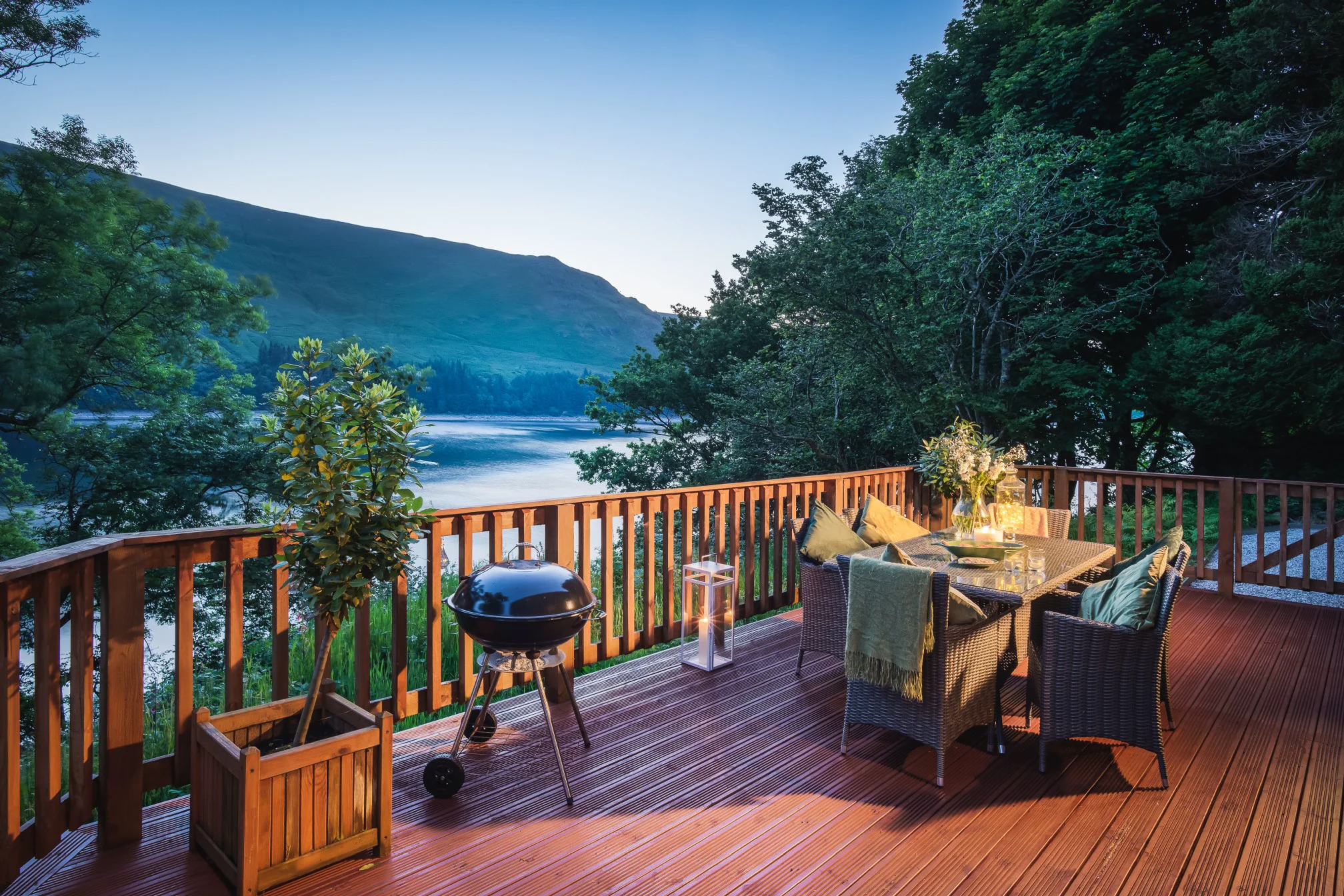 Deck with barbecue area and lake views
